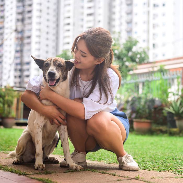 girl sitting with pet outside girl sitting with pet outside